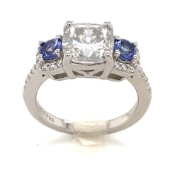 2.36 CTW Cushion Moissanite with 0.43 CTW Round Violet Blue Tanzanite Three Stone Ring in 925 Sterling Silver Plated with Rhodium